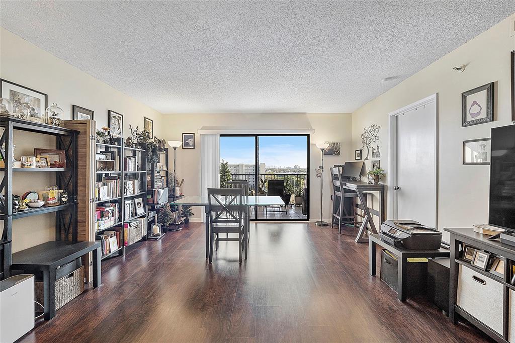 2240 North Cypress Bend Drive, Unit 908 Pompano Beach, FL 33069 - Photo 11 of 66 a living room with lots of furniture and a flat screen tv