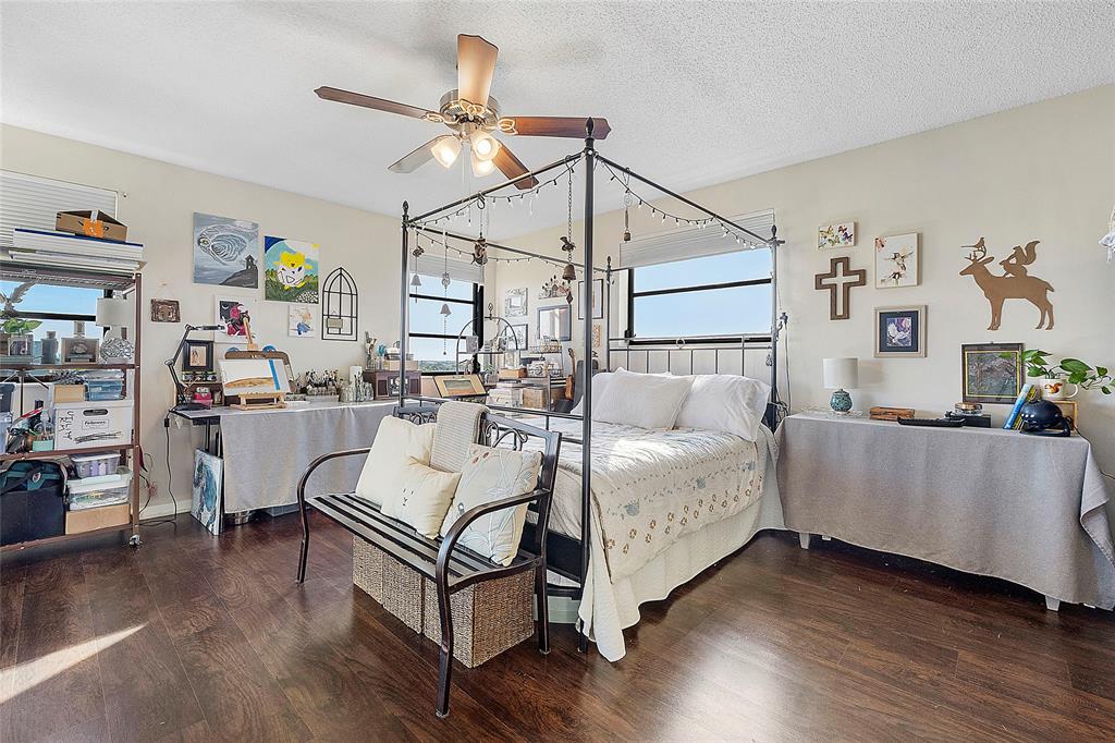 2240 North Cypress Bend Drive, Unit 908 Pompano Beach, FL 33069 - Photo 13 of 66 a living room with furniture and a wooden floor