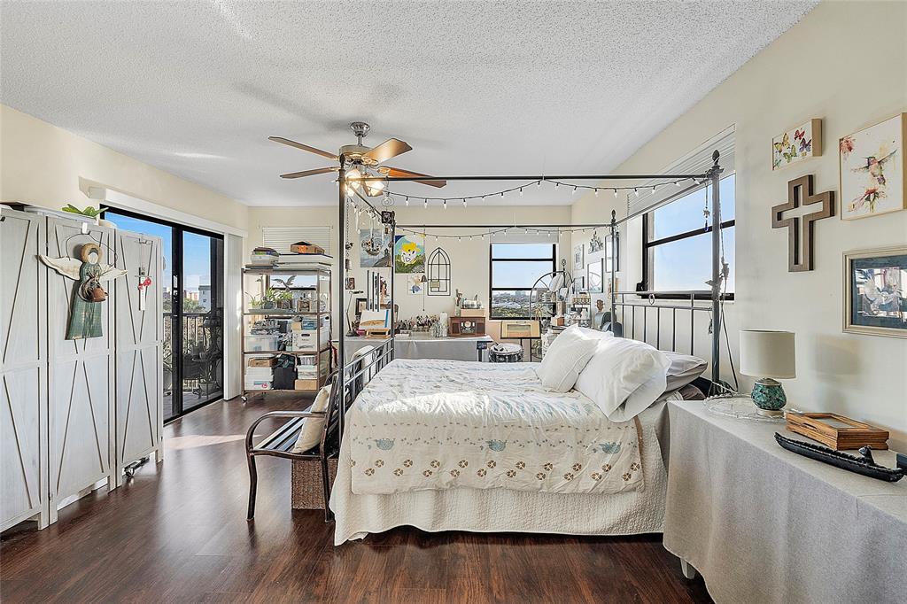 2240 North Cypress Bend Drive, Unit 908 Pompano Beach, FL 33069 - Photo 14 of 66 a living room with furniture fireplace and a large window