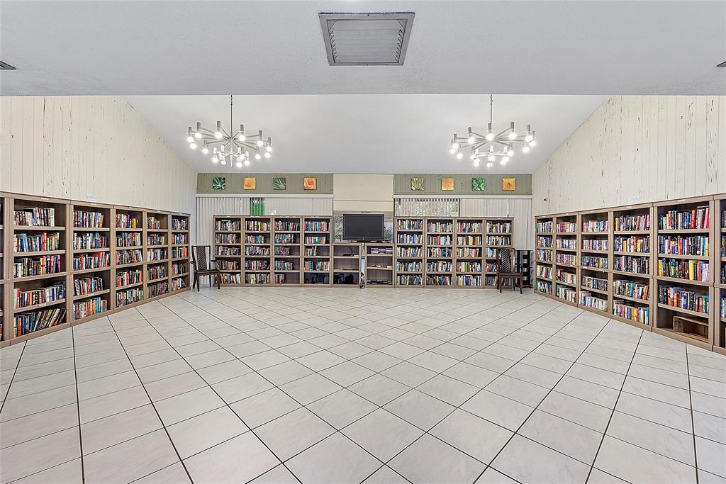 2240 North Cypress Bend Drive, Unit 908 Pompano Beach, FL 33069 - Photo 40 of 66 a view of a livingroom with furniture and chandelier