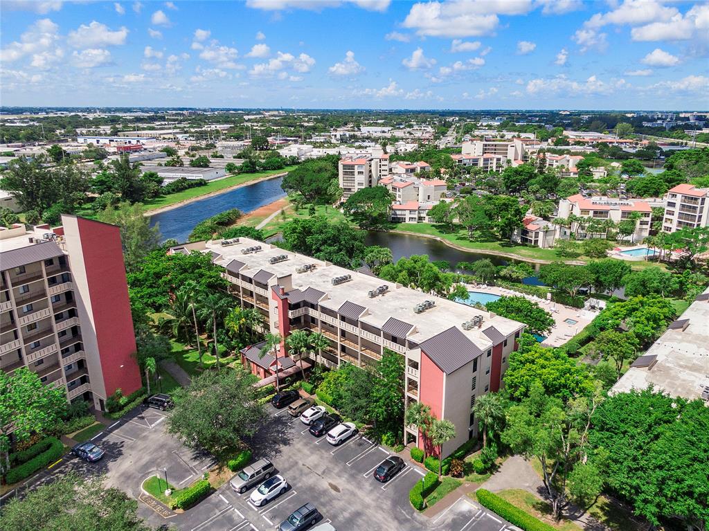 2240 North Cypress Bend Drive, Unit 908 Pompano Beach, FL 33069 - Photo 56 of 66 an aerial view of a house with a garden