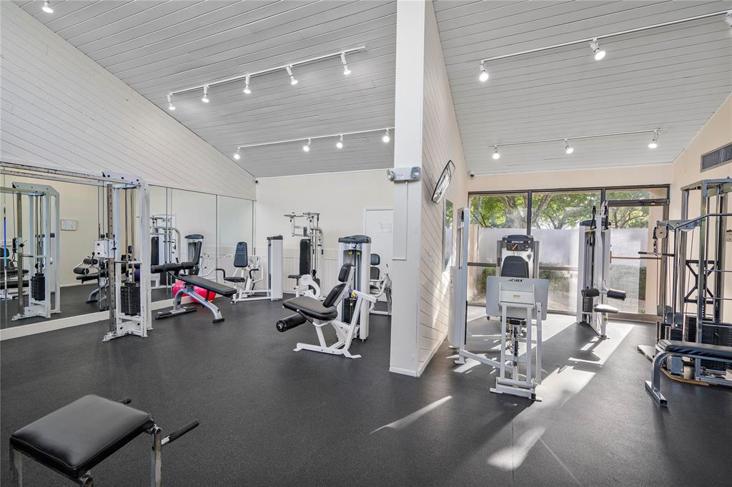 2240 North Cypress Bend Drive, Unit 908 Pompano Beach, FL 33069 - Photo 65 of 66 a view of a room with gym equipment