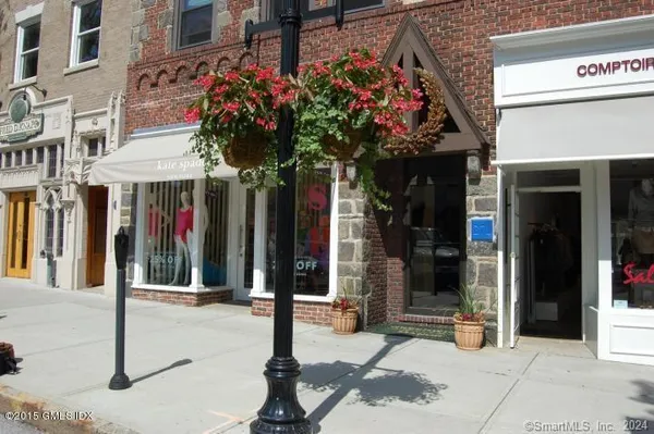 a view of path along with retail shop and buildings