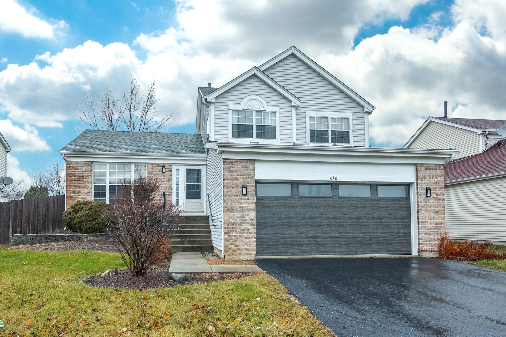 448 Bluebird Drive Bolingbrook, IL 60440 - Photo 1 of 20 a front view of a house with garden