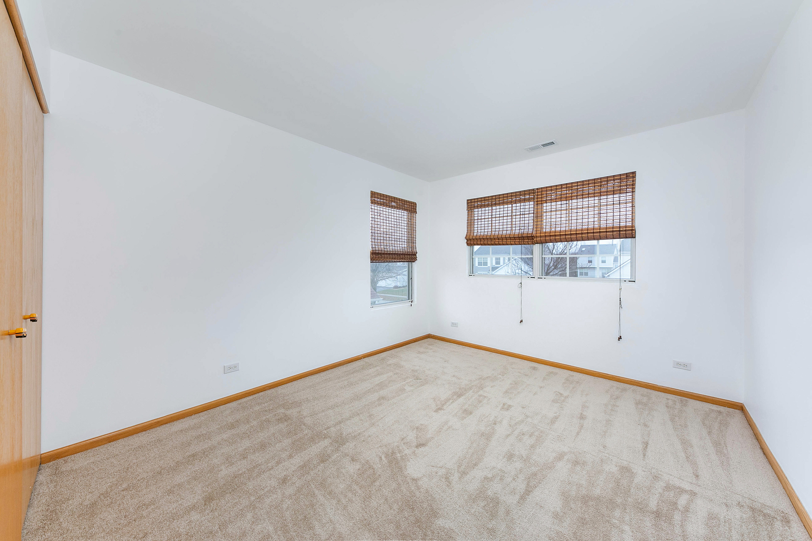 448 Bluebird Drive Bolingbrook, IL 60440 - Photo 11 of 20 an empty room with windows