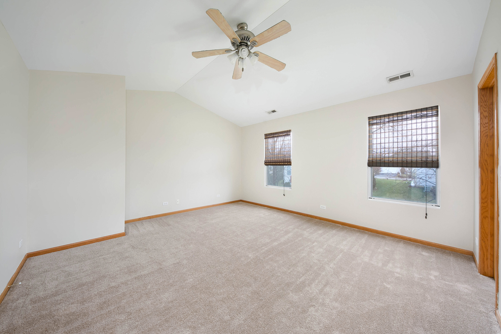 448 Bluebird Drive Bolingbrook, IL 60440 - Photo 12 of 20 an empty room with windows and entrance