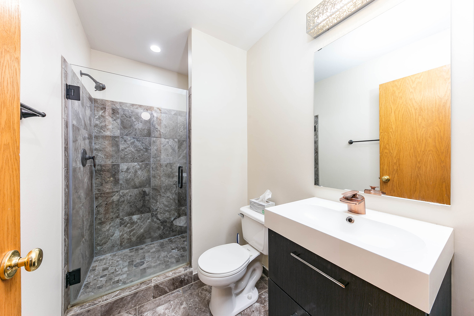448 Bluebird Drive Bolingbrook, IL 60440 - Photo 15 of 20 a bathroom with a sink toilet and shower
