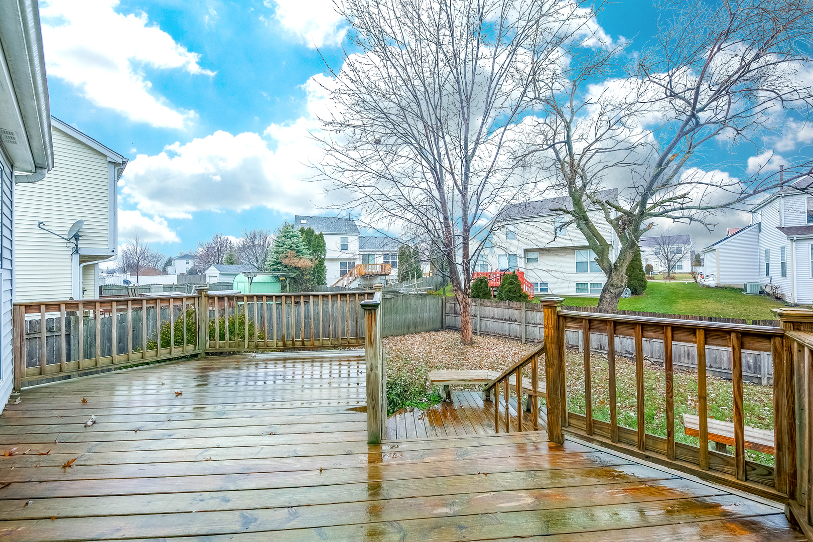448 Bluebird Drive Bolingbrook, IL 60440 - Photo 20 of 20 a view of a patio with table and chairs with wooden floor and fence