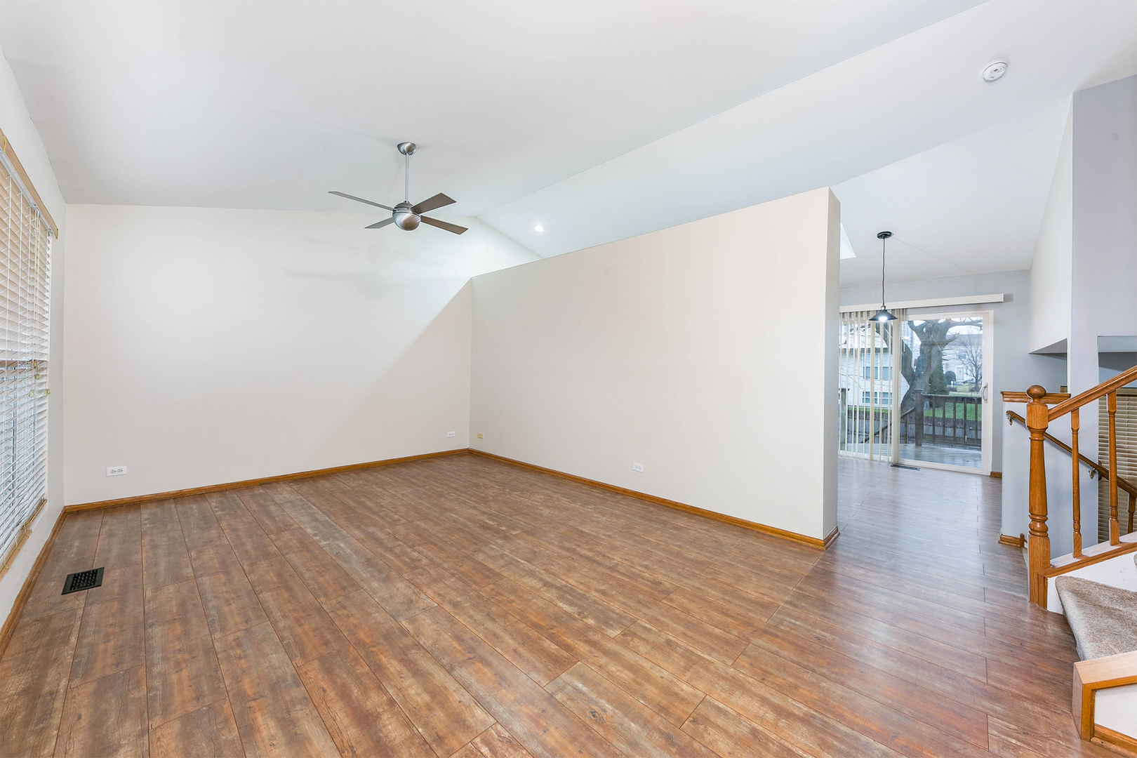 448 Bluebird Drive Bolingbrook, IL 60440 - Photo 3 of 20 wooden floor in an empty room with a window