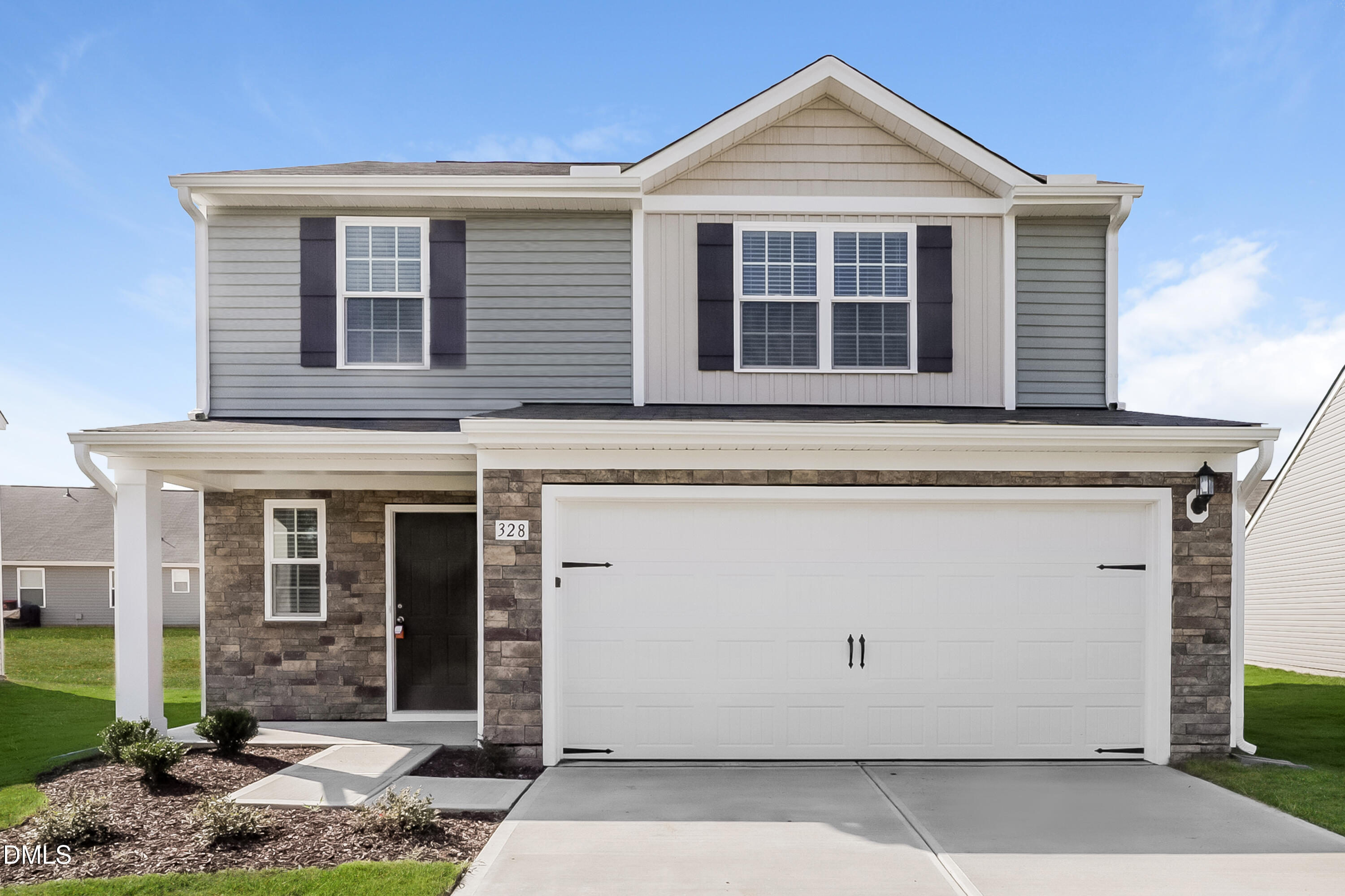 328 Gourd Street Zebulon, NC 27597 - Photo 1 of 17 a front view of a house with garden