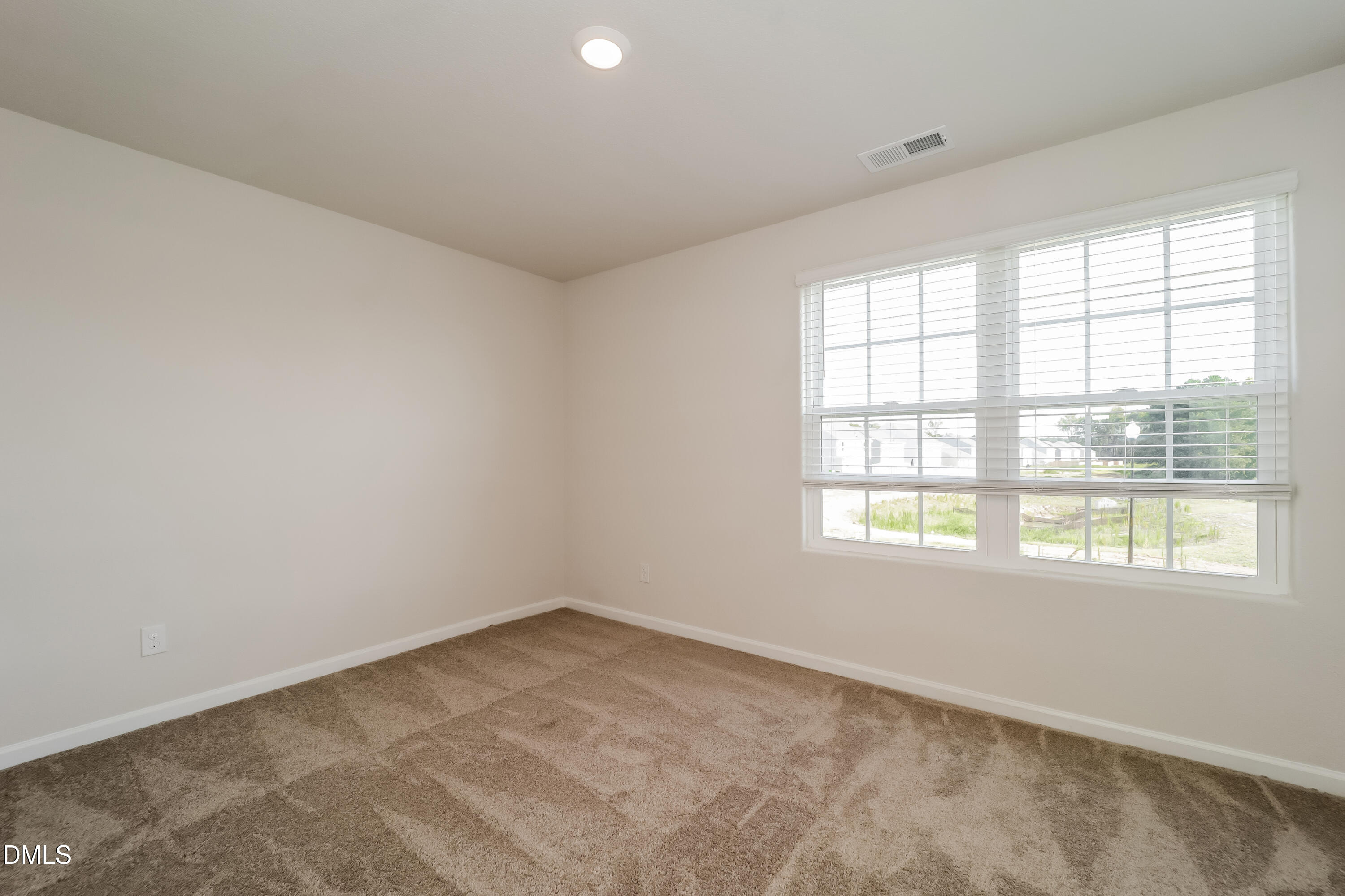 328 Gourd Street Zebulon, NC 27597 - Photo 11 of 17 an empty room with a window