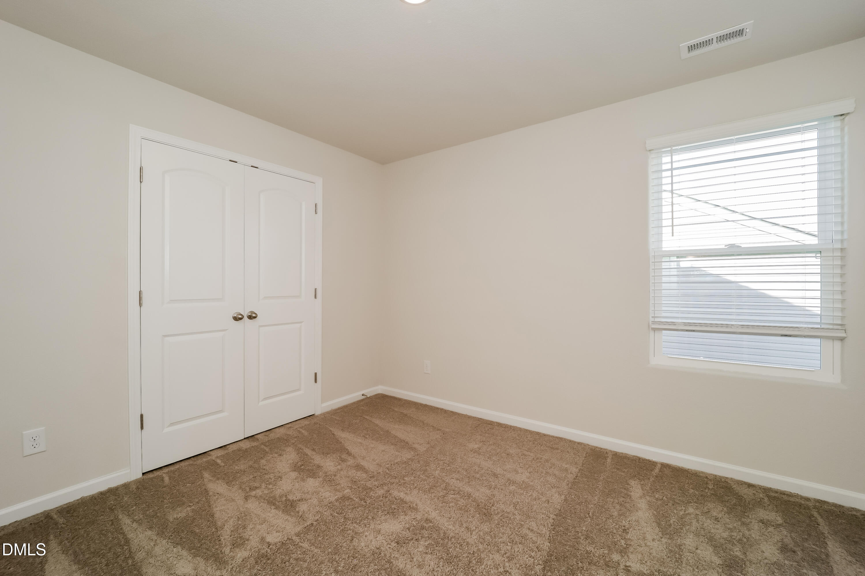 328 Gourd Street Zebulon, NC 27597 - Photo 12 of 17 a view of a room that has a window in it