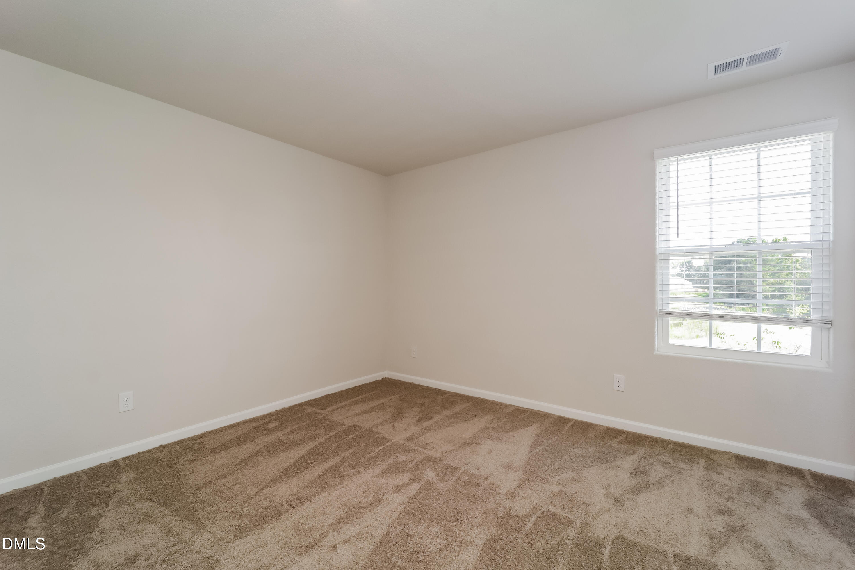 328 Gourd Street Zebulon, NC 27597 - Photo 13 of 17 an empty room with a window