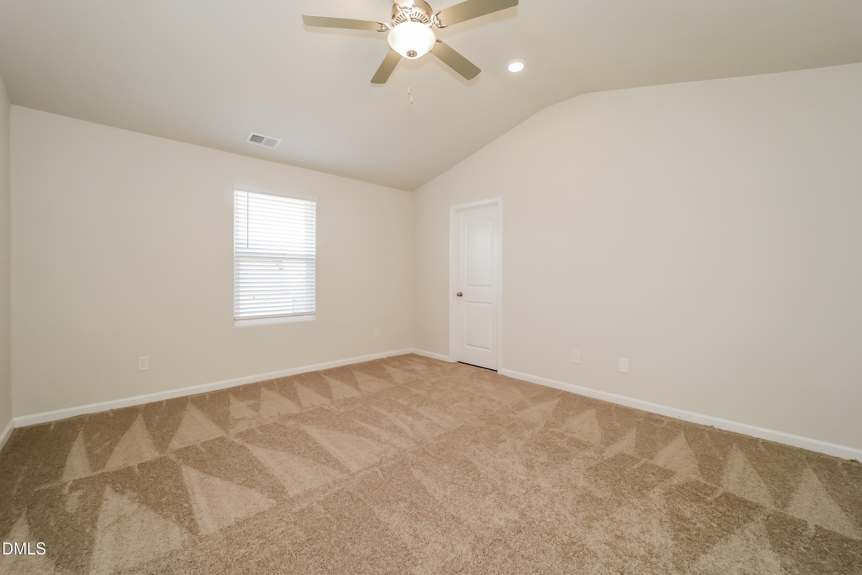328 Gourd Street Zebulon, NC 27597 - Photo 7 of 17 an empty room with windows and fan
