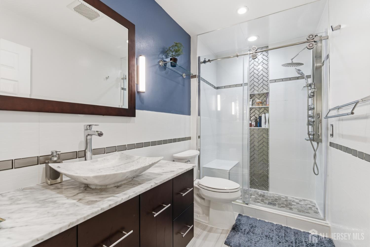 26 Alexis Lane Edison, NJ 08820 - Photo 29 of 39 a bathroom with a granite countertop sink toilet and shower