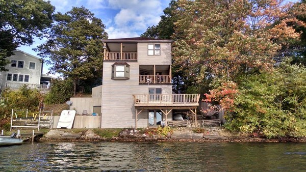 105 Kimball Road Amesbury, MA 01913 - Photo 1 of 20 a front view of a house with a ocean view