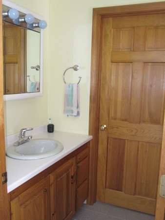 105 Kimball Road Amesbury, MA 01913 - Photo 13 of 20 a bathroom with a sink vanity and mirror