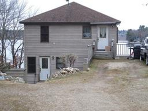105 Kimball Road Amesbury, MA 01913 - Photo 5 of 20 a view of a house with a yard and garage
