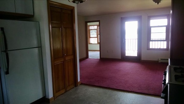 105 Kimball Road Amesbury, MA 01913 - Photo 7 of 20 a view of empty room with window and refrigerator