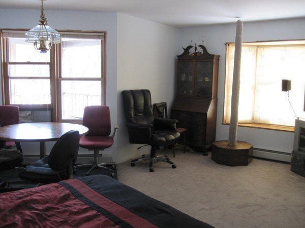 105 Kimball Road Amesbury, MA 01913 - Photo 9 of 20 a view of a workspace with furniture and a window
