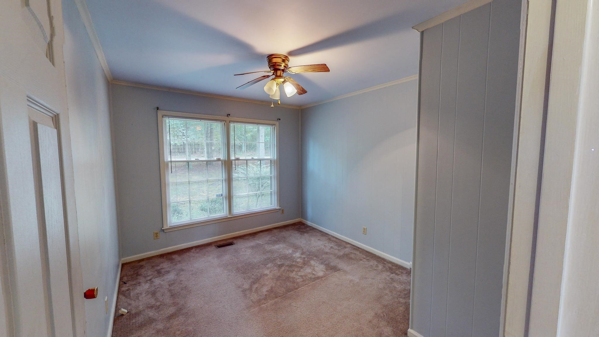 5516 Old NC 10 Durham, NC 27705 - Photo 16 of 26 an empty room with windows and fan