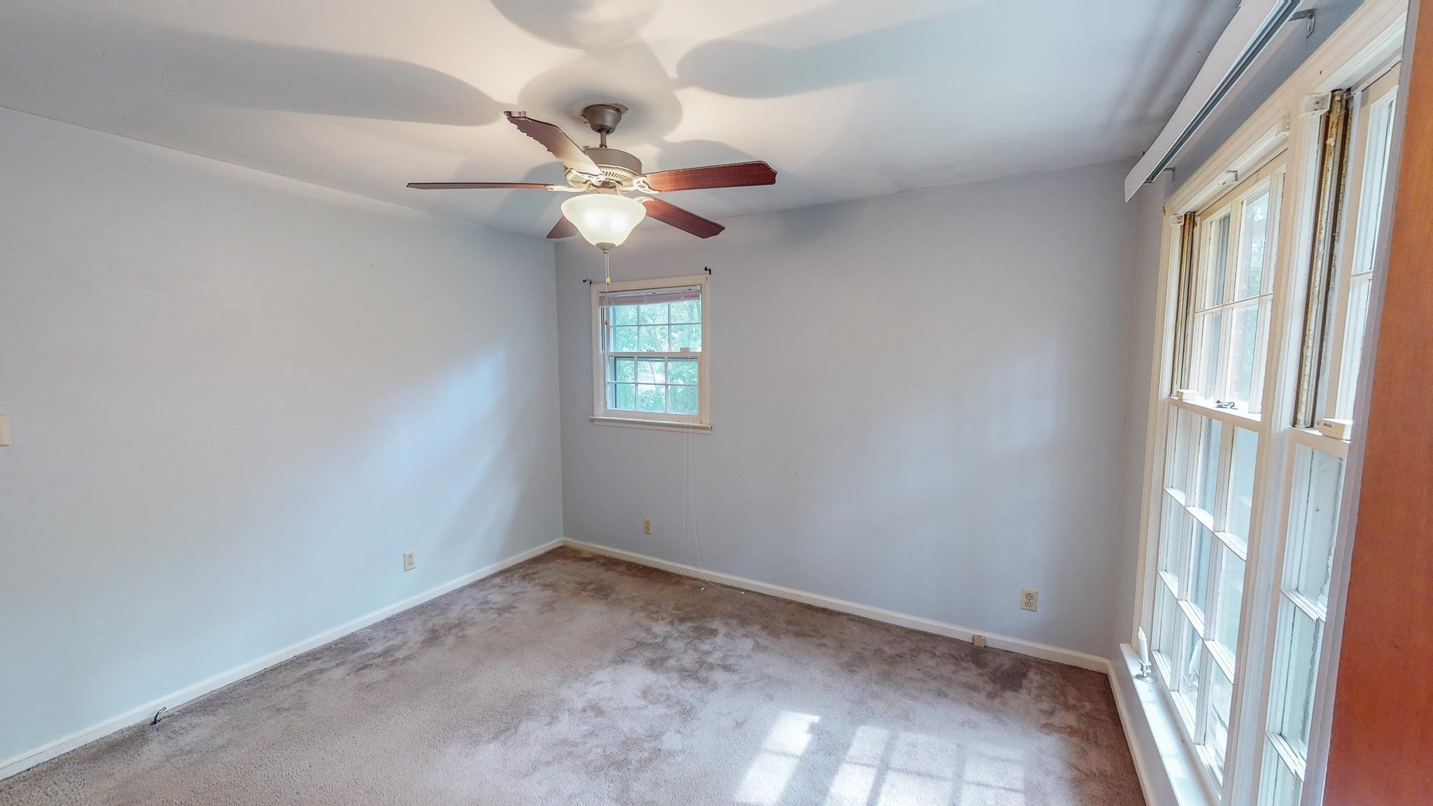 5516 Old NC 10 Durham, NC 27705 - Photo 22 of 26 an empty room with windows and fan