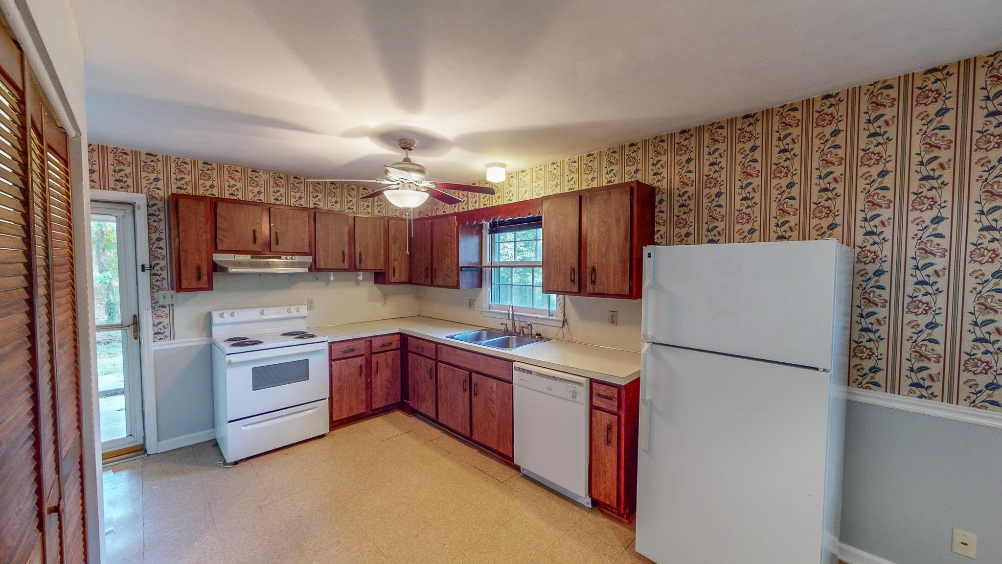 5516 Old NC 10 Durham, NC 27705 - Photo 3 of 26 a kitchen with stainless steel appliances granite countertop a refrigerator a stove top oven a sink and dishwasher