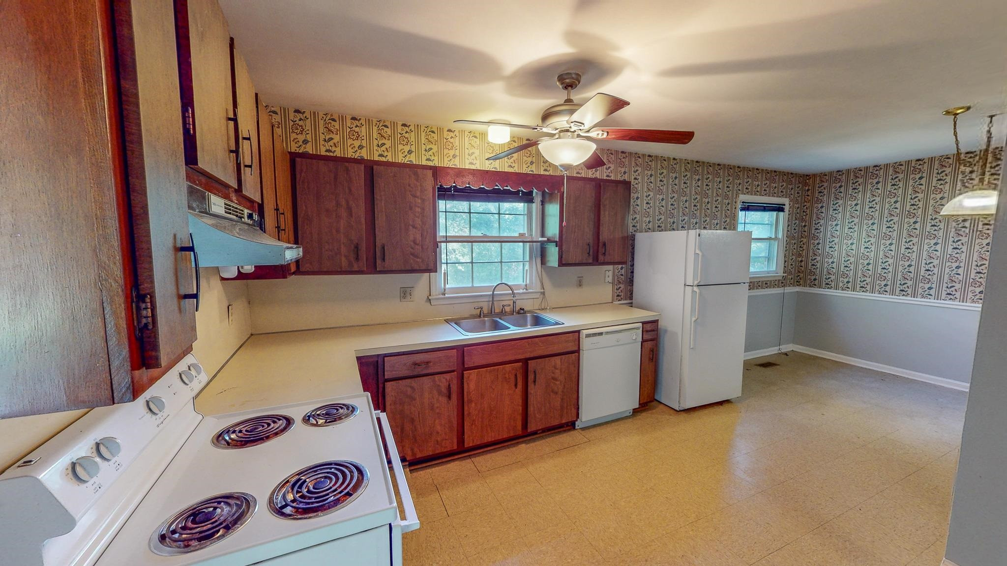 5516 Old NC 10 Durham, NC 27705 - Photo 4 of 26 a kitchen with a refrigerator and a stove