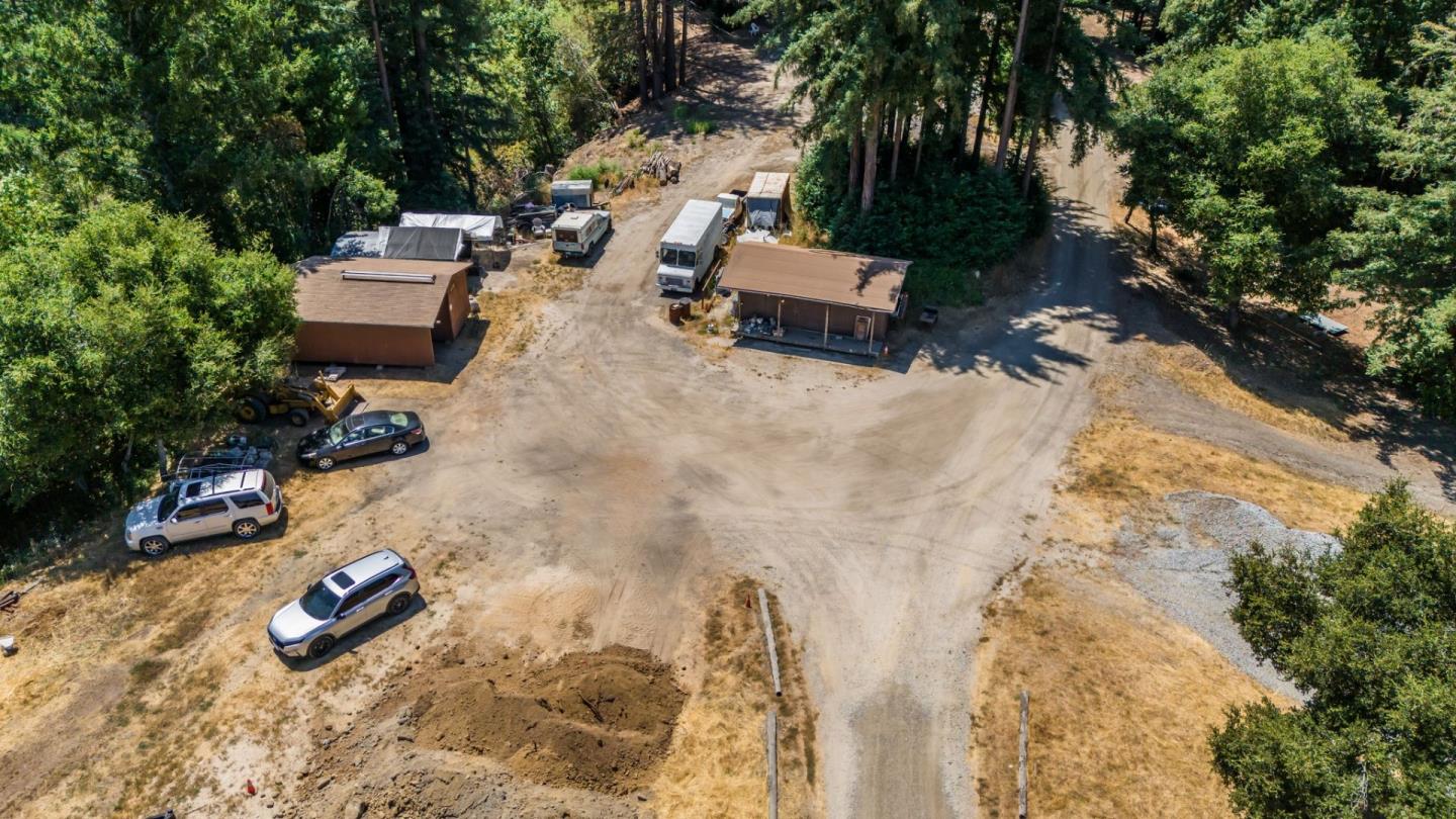 9000 Lompico Road Felton, CA 95018 - Photo 11 of 28 an aerial view of a swimming pool with outdoor seating and trees