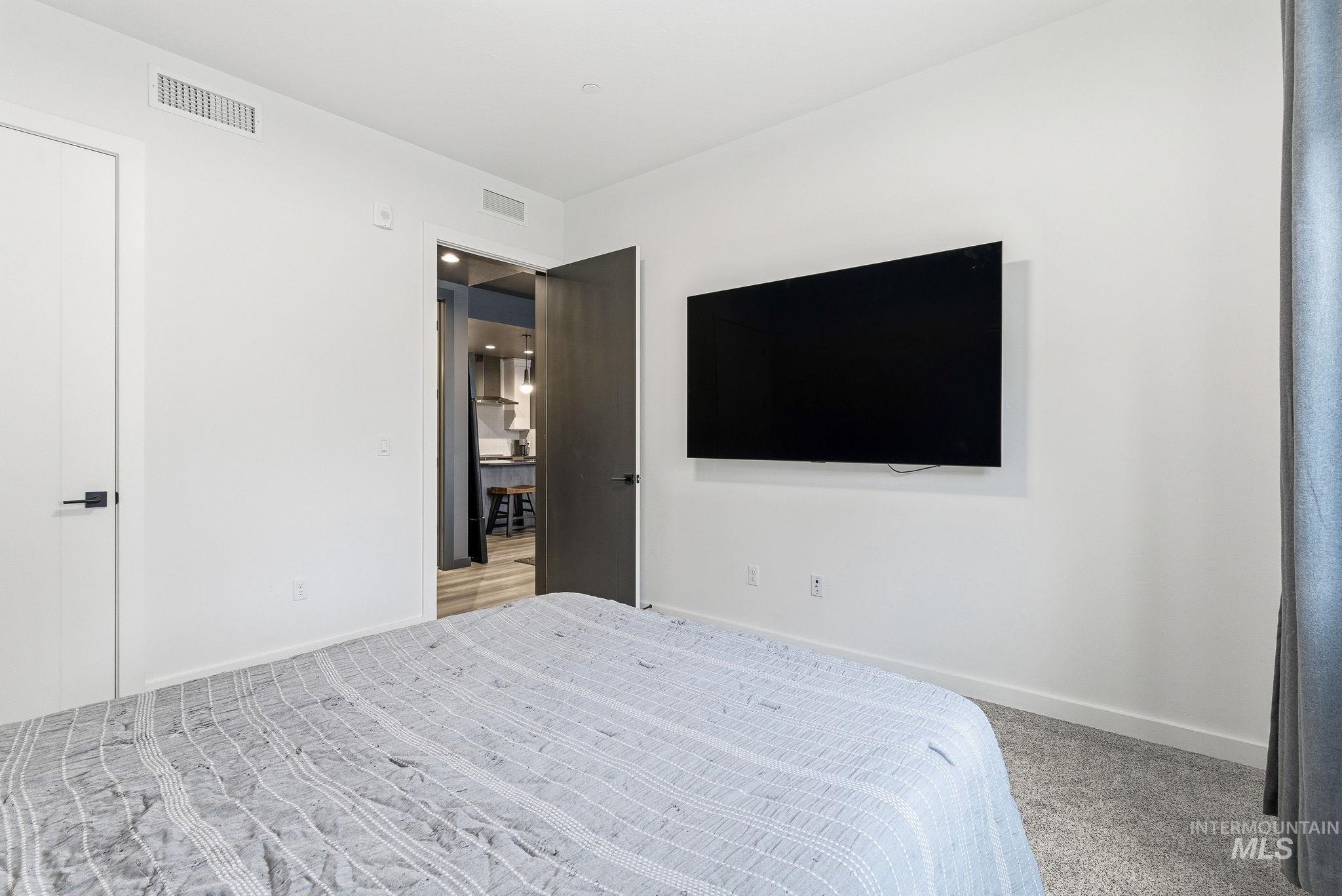 3928 East Haystack Street, Unit 107 Boise, ID 83716 - Photo 15 of 37 Bedroom with carpet flooring and baseboards
