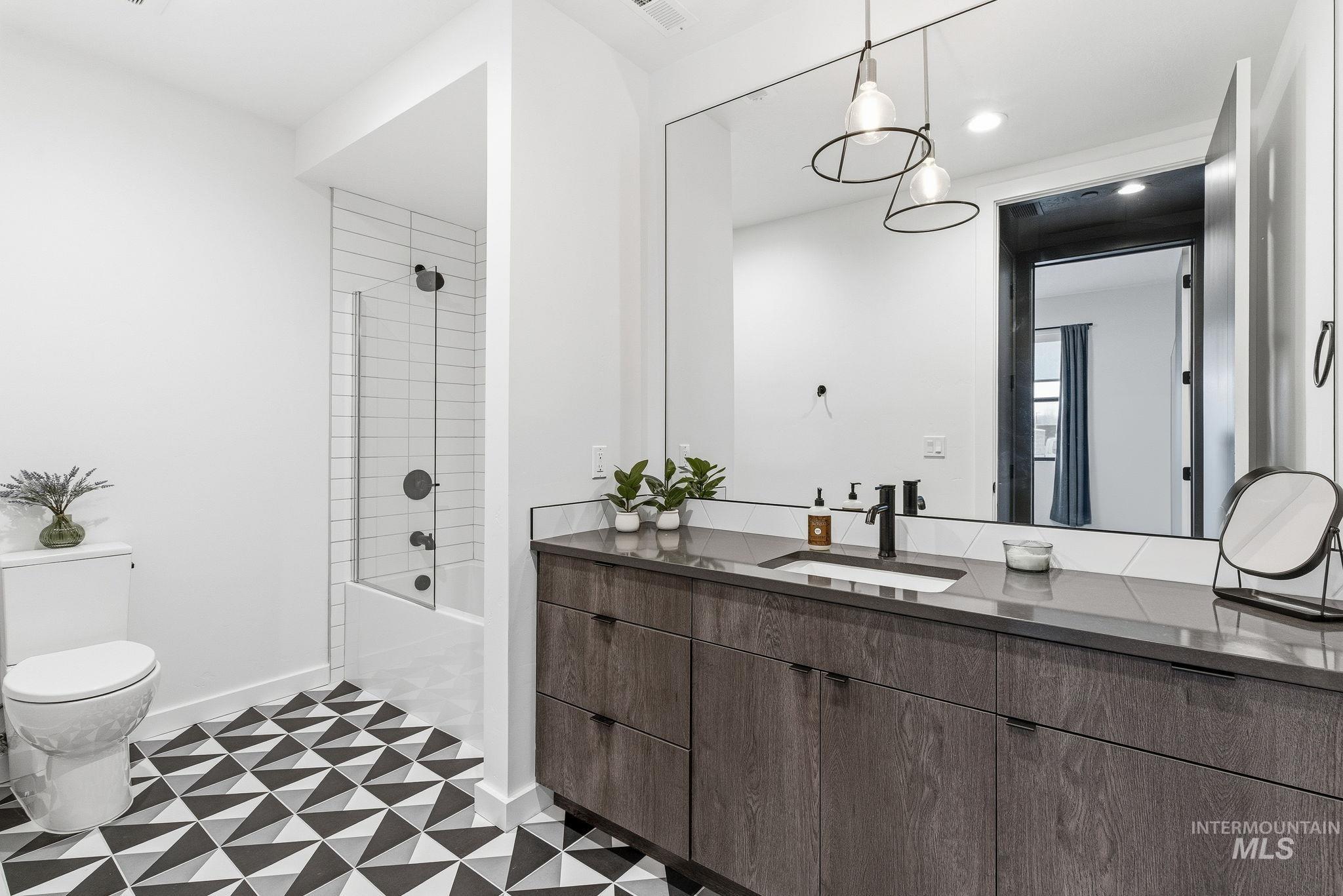 3928 East Haystack Street, Unit 107 Boise, ID 83716 - Photo 18 of 37 Bathroom featuring vanity, tub / shower combination, light flooring, and recessed lighting