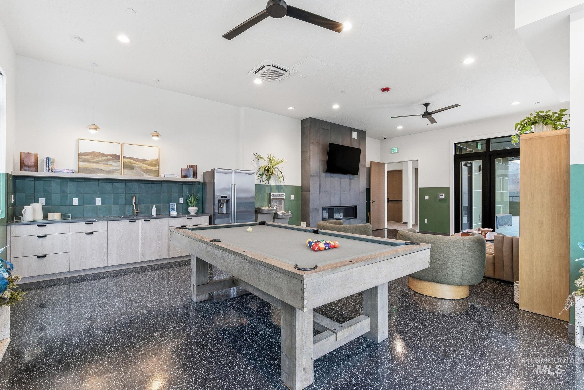 3928 East Haystack Street, Unit 107 Boise, ID 83716 - Photo 24 of 37 Rec room featuring billiards, ceiling fan, a tile fireplace, and recessed lighting