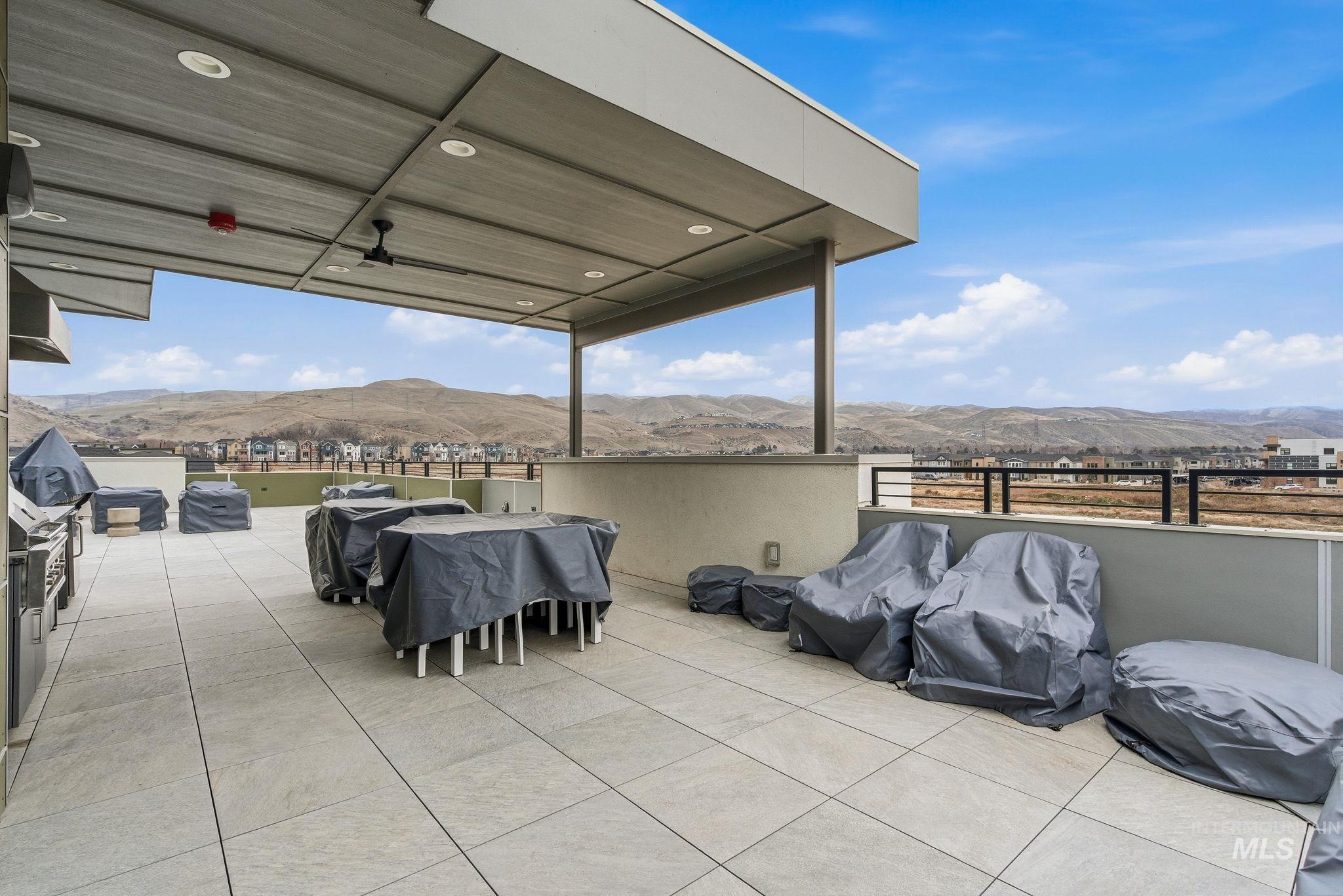 3928 East Haystack Street, Unit 107 Boise, ID 83716 - Photo 27 of 37 View of patio with a mountain view and area for grilling