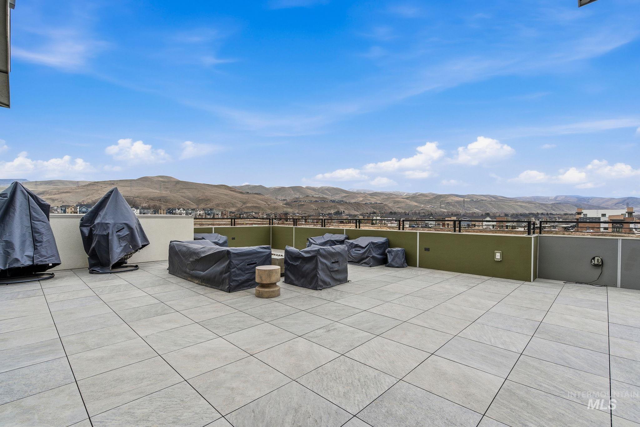 3928 East Haystack Street, Unit 107 Boise, ID 83716 - Photo 29 of 37 View of patio / terrace with a mountain view and area for grilling