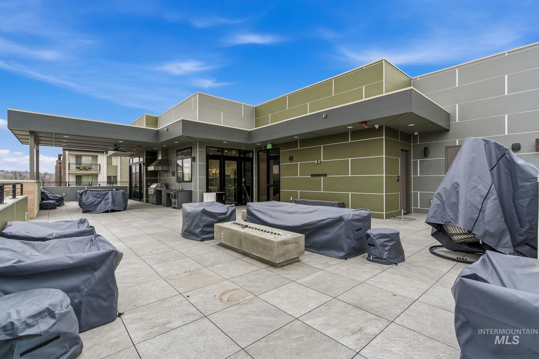 3928 East Haystack Street, Unit 107 Boise, ID 83716 - Photo 30 of 37 View of patio / terrace with a fire pit and a grill