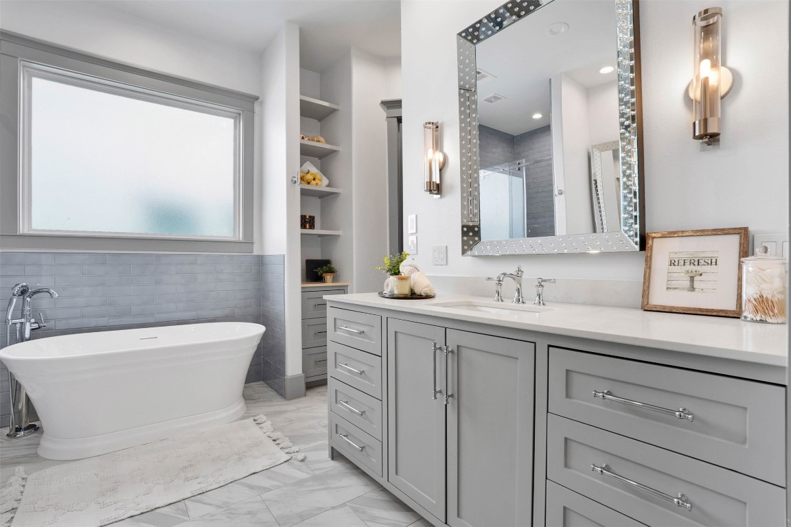 Your Private Sanctuary.
Indulge in a recently remodeled, spa-inspired primary bath featuring sleek quartz finishes, a designer stand-alone soaking tub, and an oversized shower.