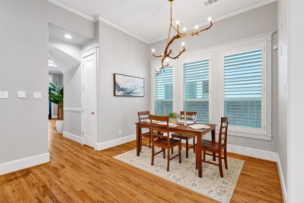 612 Rutland Street Houston, TX 77007 - Photo 18 of 45 Artful Mornings. The sun-drenched breakfast nook features a one-of-a-kind custom light fixture, serving as a stunning centerpiece for your morning coffee.