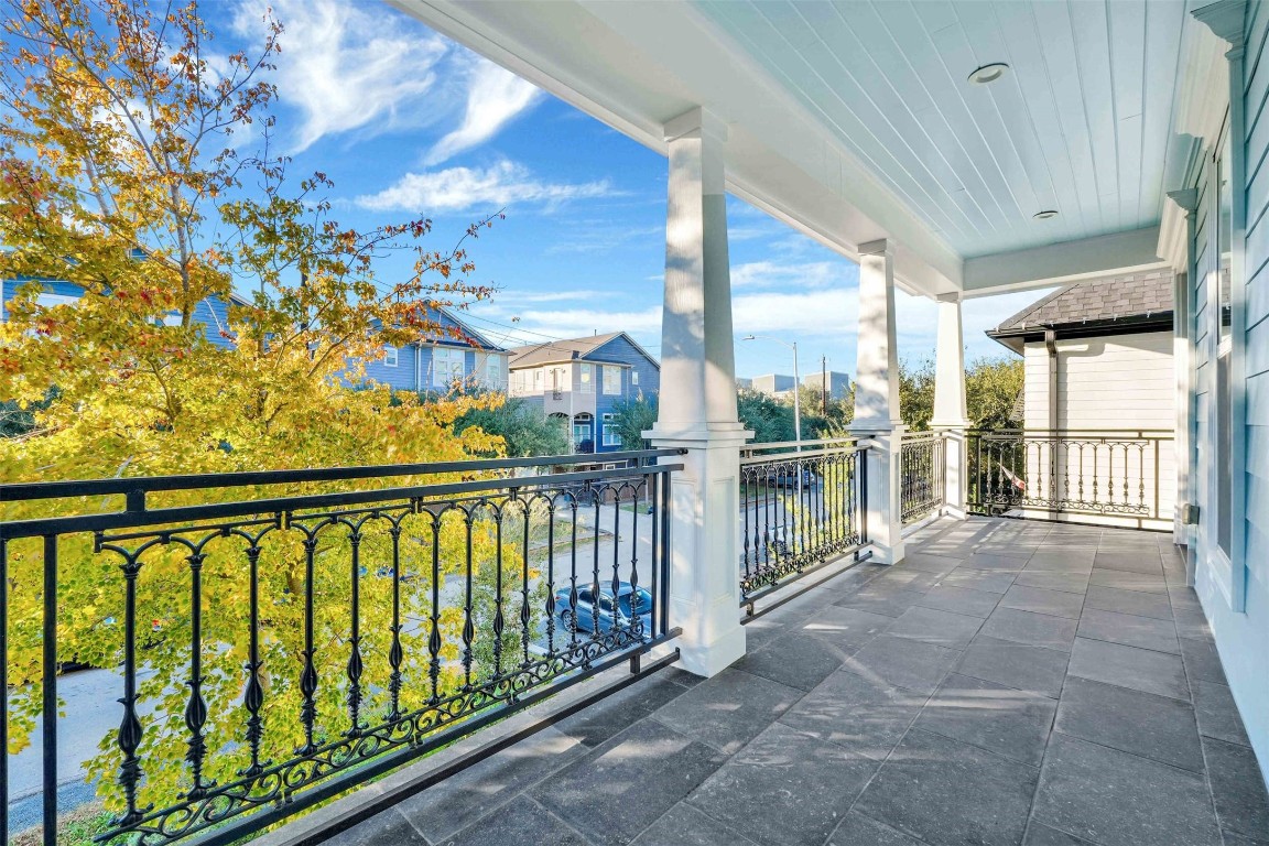 612 Rutland Street Houston, TX 77007 - Photo 26 of 45 Elevated Outdoor Living. Double French doors bridge the gap between work and relaxation. This versatile office and the adjacent guest bedroom both open onto a wide covered balcony, offering a serene "treetop" vantage point over the neighborhood.