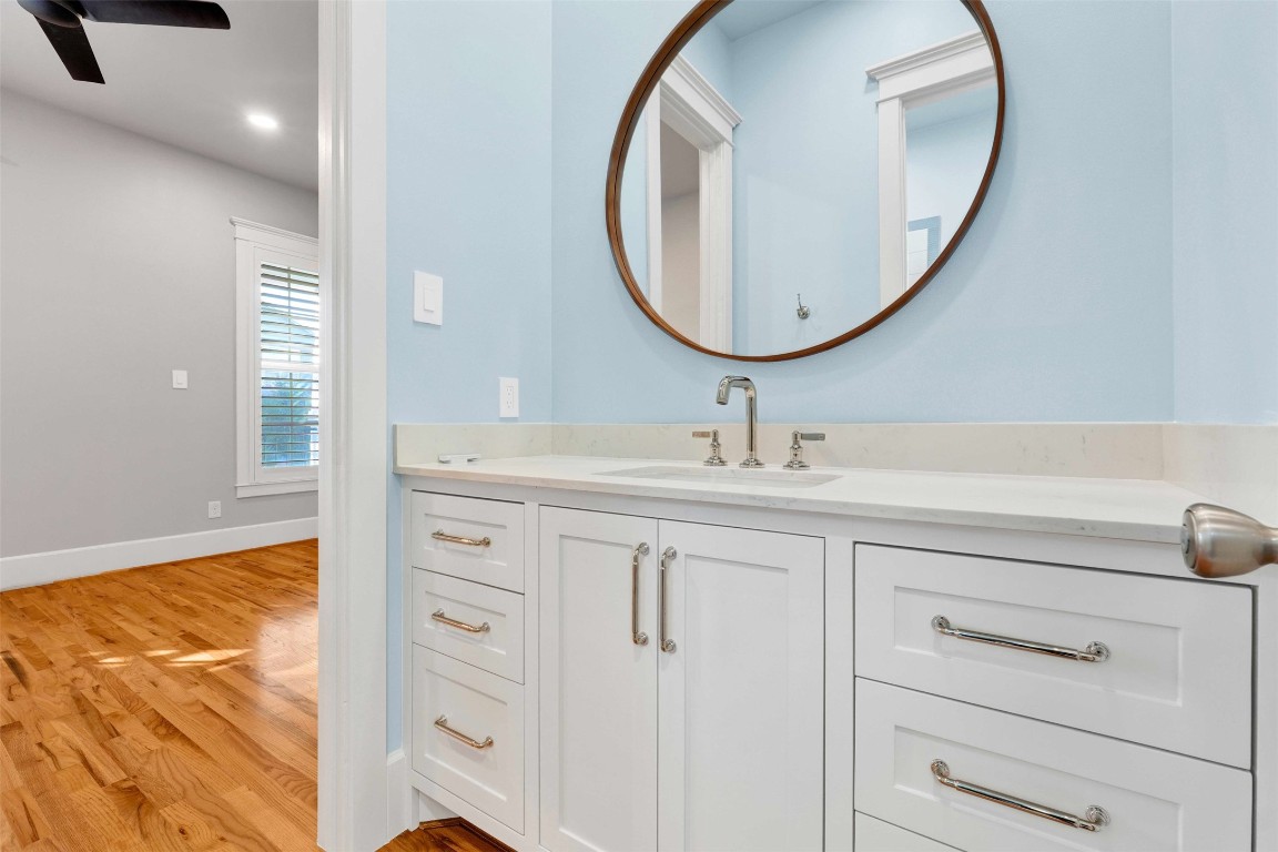 612 Rutland Street Houston, TX 77007 - Photo 29 of 45 Each of the adjoining bedrooms features its own dedicated private sink and vanity area, ensuring a seamless morning routine for everyone.