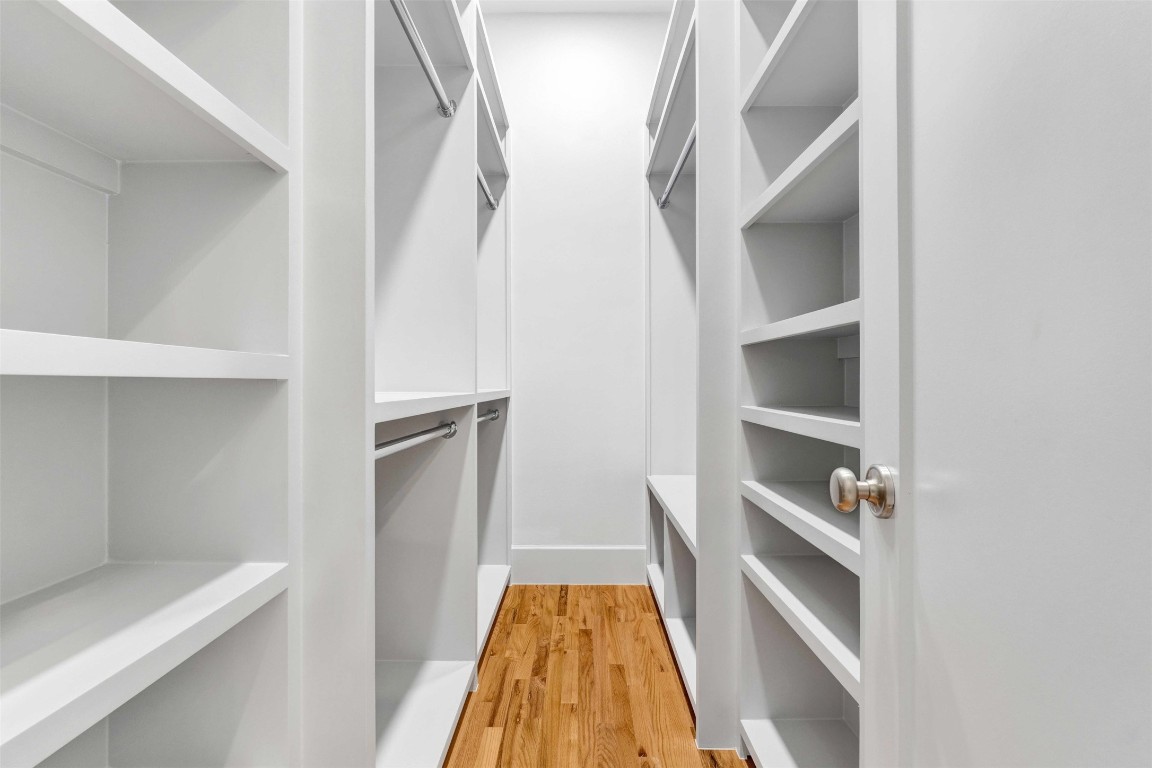 612 Rutland Street Houston, TX 77007 - Photo 40 of 45 The Ultimate Closet Suite. Why settle for one when you can have two? These massive dual walk-in closets are a true wardrobe gallery, featuring floor-to-ceiling custom shelving, dedicated hanging space, and integrated shoe towers—all illuminated by a crisp, modern aesthetic.