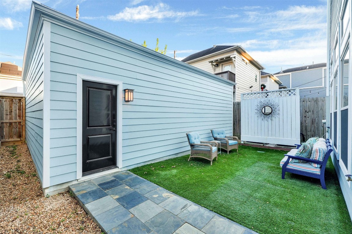 612 Rutland Street Houston, TX 77007 - Photo 42 of 45 Triple Parking. The entertaining area leads to the detached 3-car garage—a rare find that offers secure parking and incredible flex-space potential in a premier urban location.