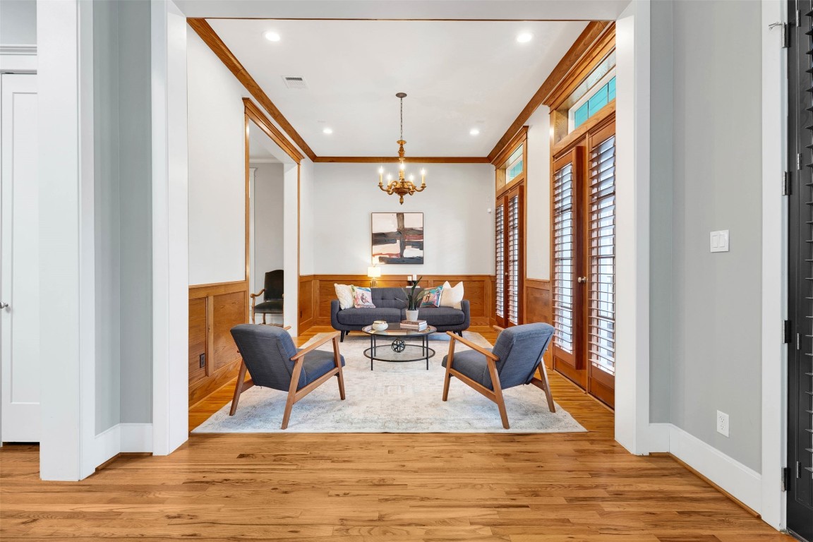 612 Rutland Street Houston, TX 77007 - Photo 9 of 45 Refined Versatility. A sophisticated parlor that adapts to your life. Whether used as an elegant music room, a formal sitting area, or a secondary lounge, this space anchors the home with its soaring ceilings and impeccable millwork.