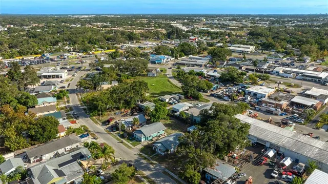 an aerial view of a residential houses with outdoor space