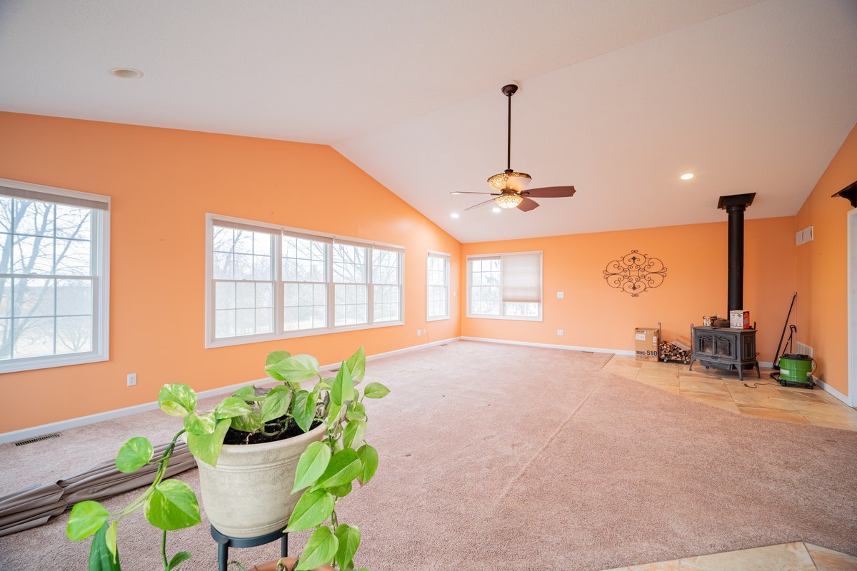 8401 Idlewood Road Clinton, IL 61727 - Photo 13 of 42 a view of a room with a potted plant and a large window