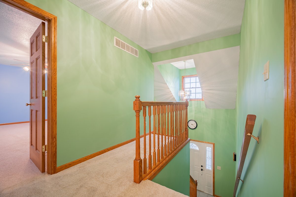 8401 Idlewood Road Clinton, IL 61727 - Photo 20 of 42 a view of a hallway with windows