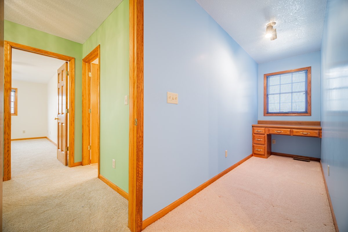 8401 Idlewood Road Clinton, IL 61727 - Photo 23 of 42 a room that has a bed and a window