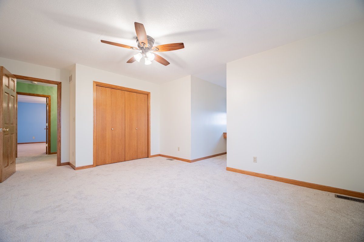 8401 Idlewood Road Clinton, IL 61727 - Photo 26 of 42 an empty room with closet and fan