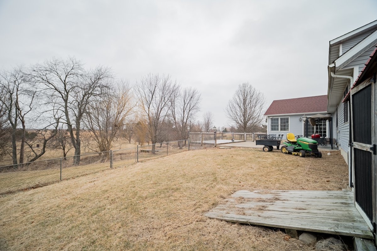 8401 Idlewood Road Clinton, IL 61727 - Photo 39 of 42 a front view of house with yard and trees in the background