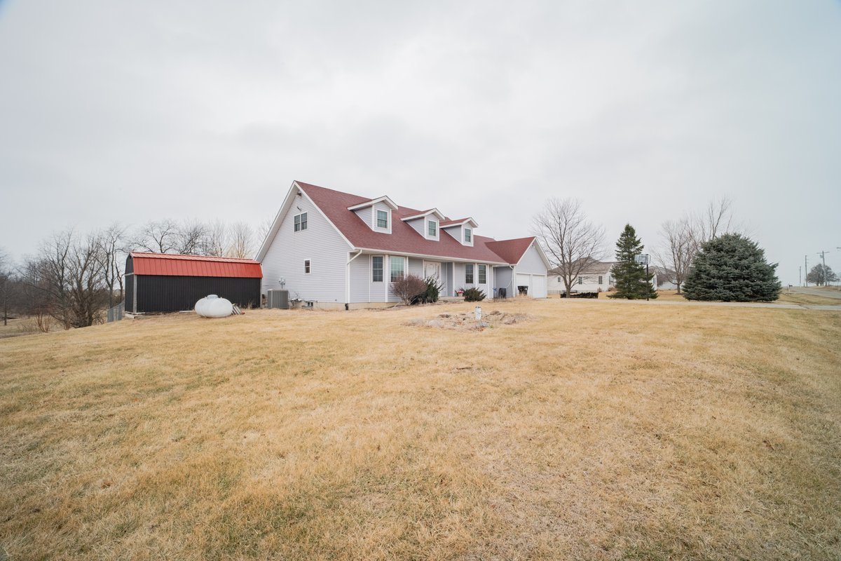 8401 Idlewood Road Clinton, IL 61727 - Photo 5 of 42 a view of house with a yard