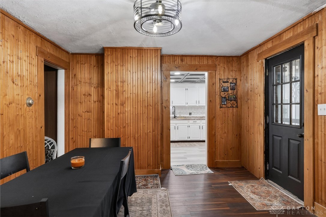 1726 Morgan Street Springfield, OH 45503 - Photo 9 of 30 This warm space features classic wood paneling and sleek dark flooring, with a modern ceiling fixture.